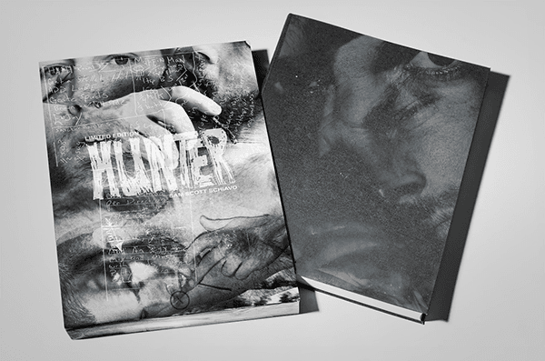Hardcover Hunter book and its textured slipcase displayed together, both featuring smudged monochrome cover art.