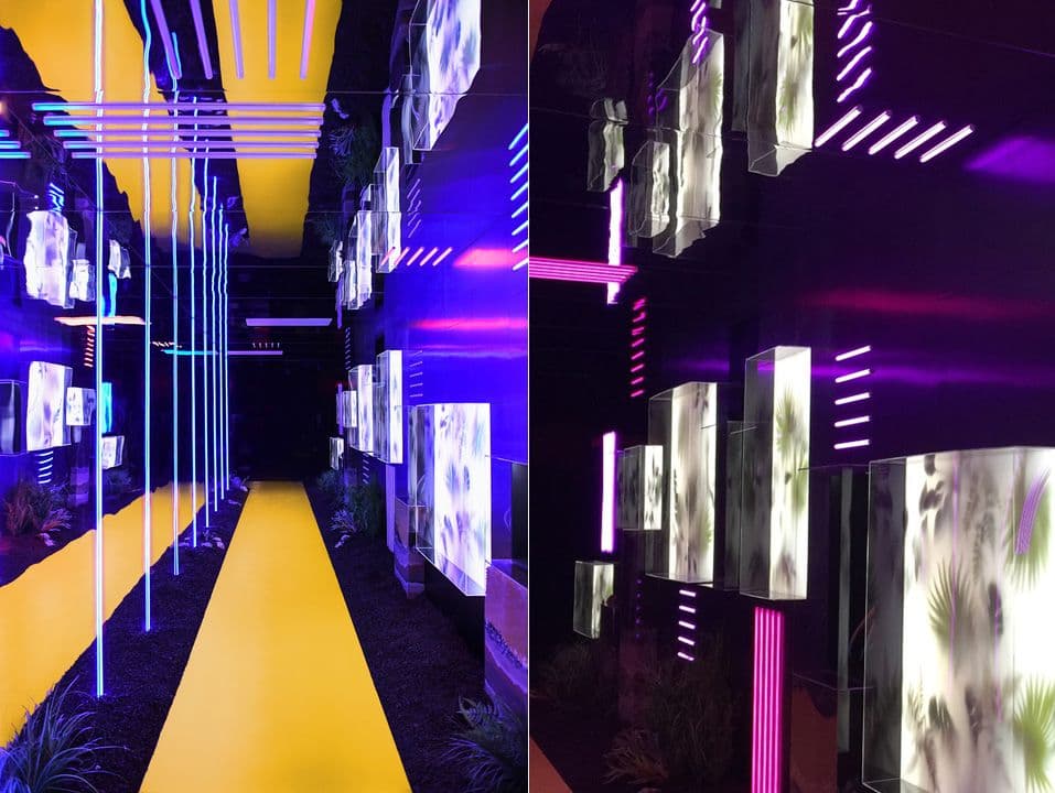 Split view of a yellow-striped walkway lined with glowing display panels and a close-up of illuminated glass boxes with plant motifs under pink neon strips.
