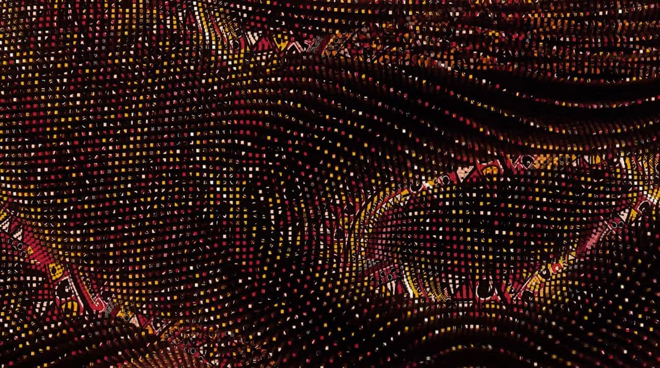 Abstract curved wall of gold and red dotted light patterns resembling a flowing wave.