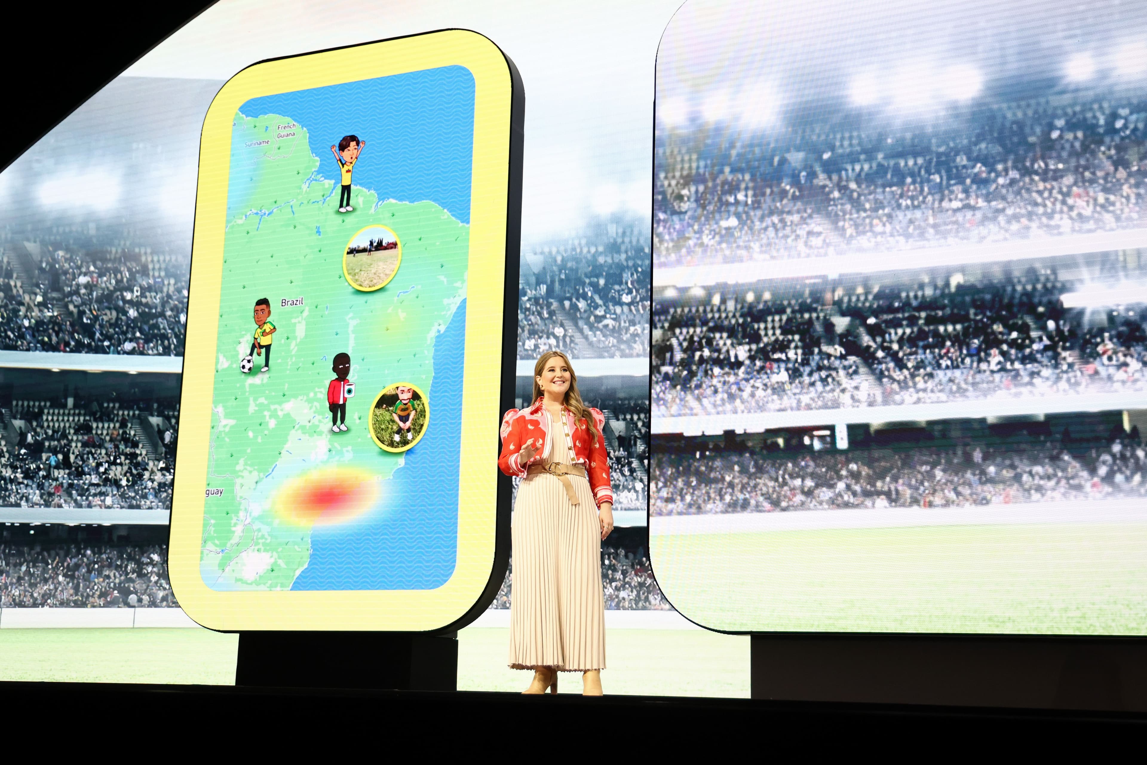 Split screen showing a map app interface beside a presenter on stage at a stadium.