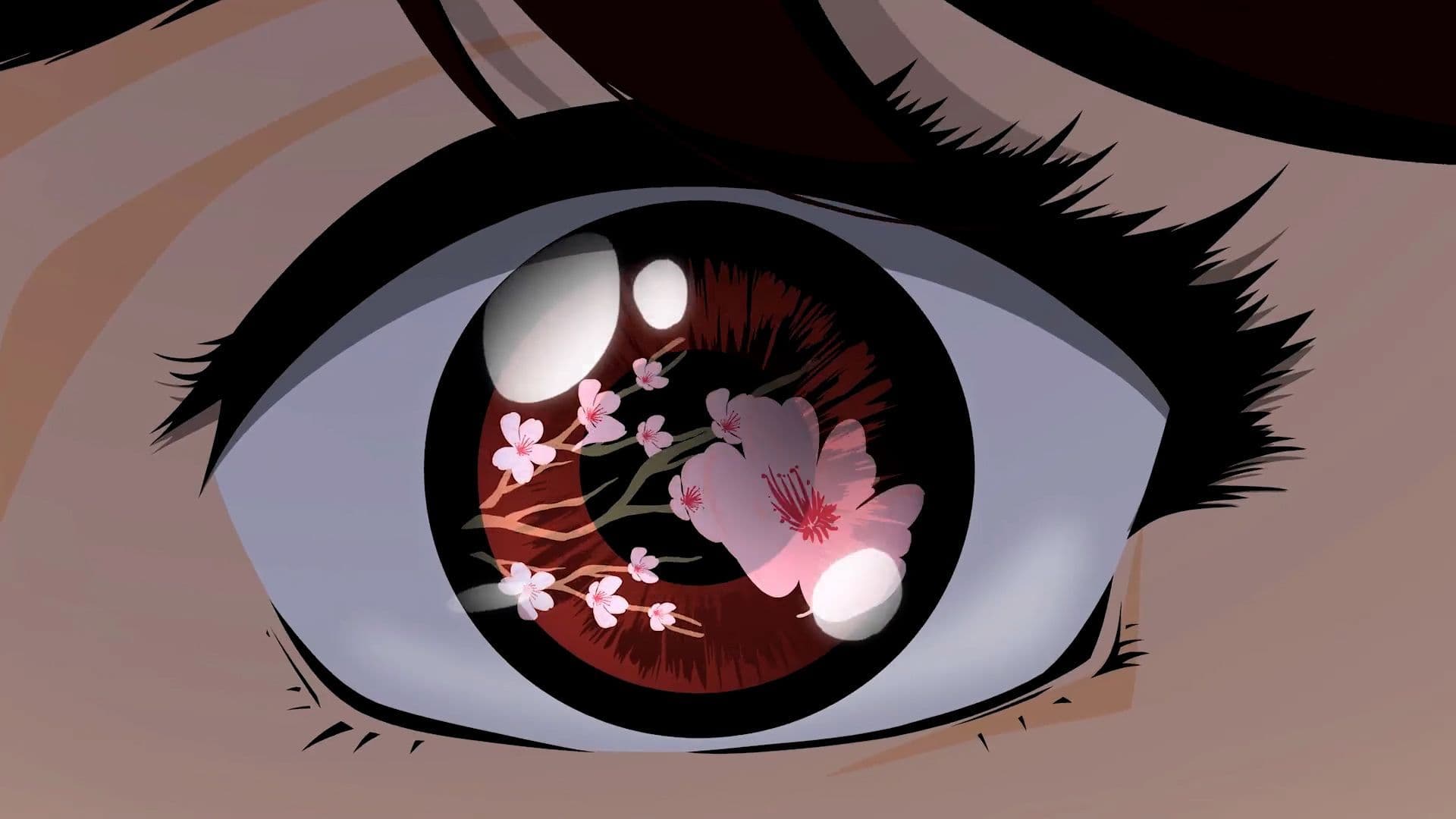 Close-up of an eye with a cherry blossom branch reflected in the iris.