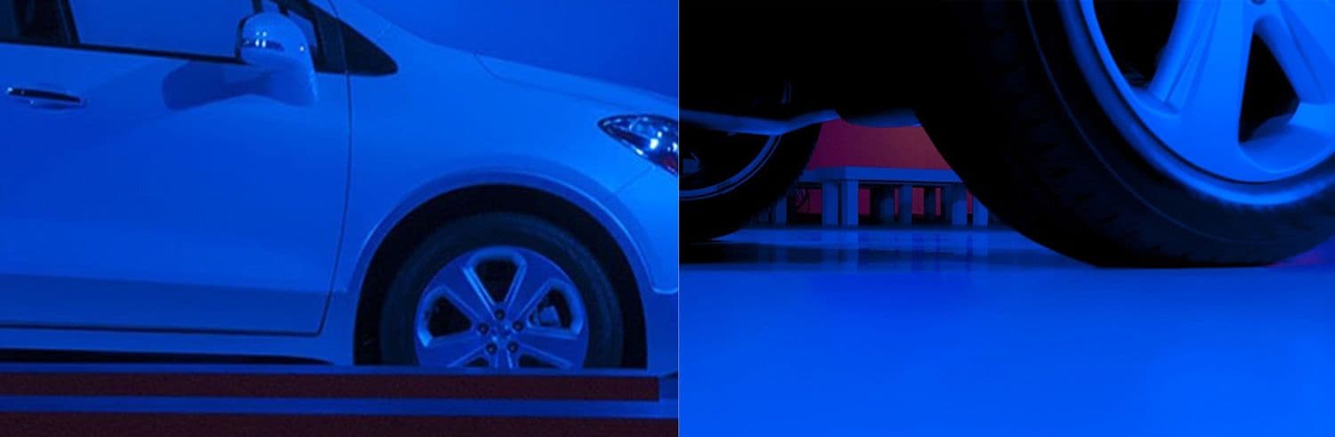 Split image of a car's side and wheel in blue light next to a close-up of a tire in dark blue light.