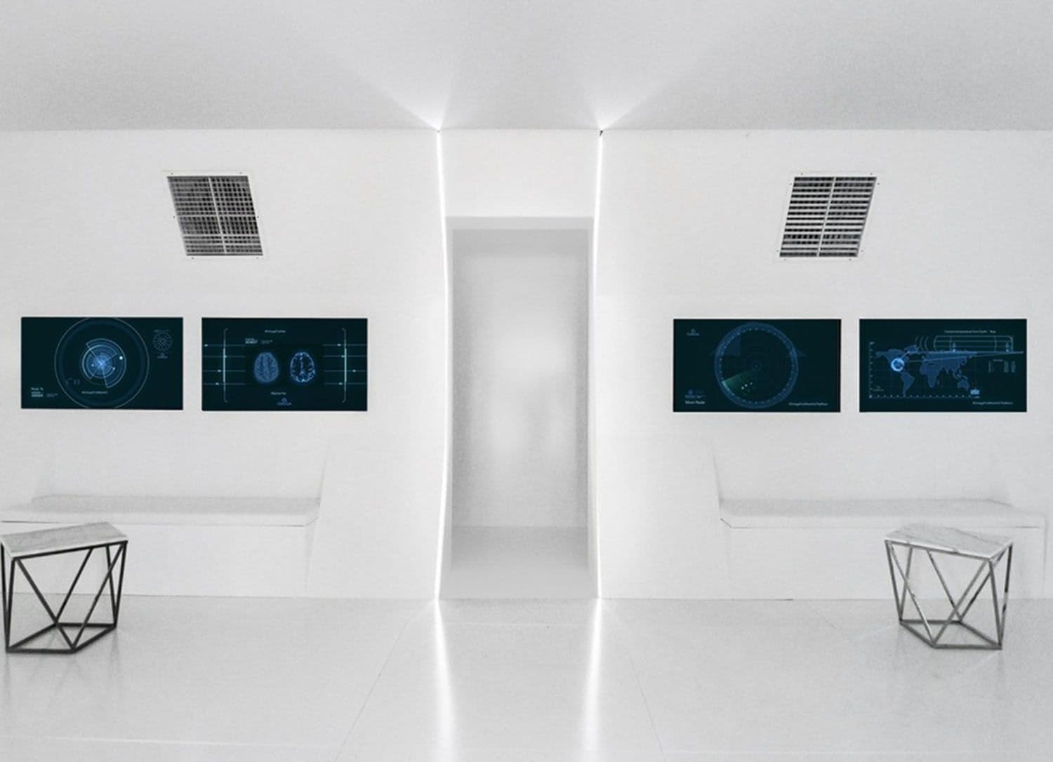 White corridor lined with four wall-mounted screens displaying radar and brain-scan style graphics, flanked by geometric side tables.