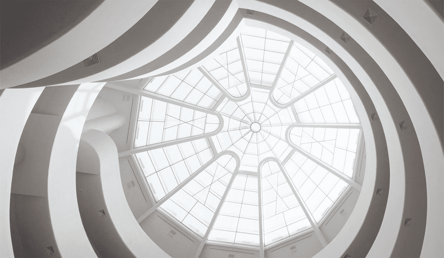 Looking straight up into the Guggenheim rotunda's spiral ramp and glass oculus skylight