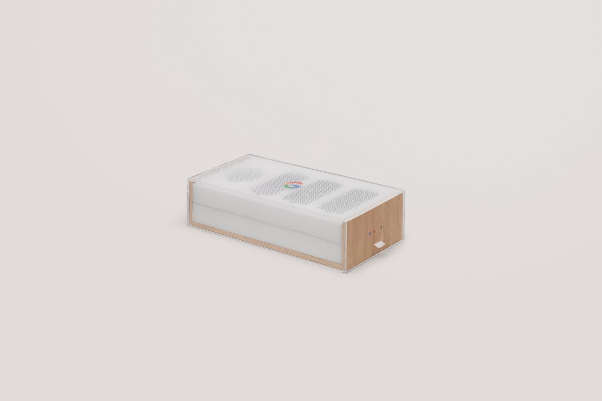 Single wood-and-frosted-acrylic box with a perforated speaker-grille lid and a small Google 'G' logo, shown against a plain background.
