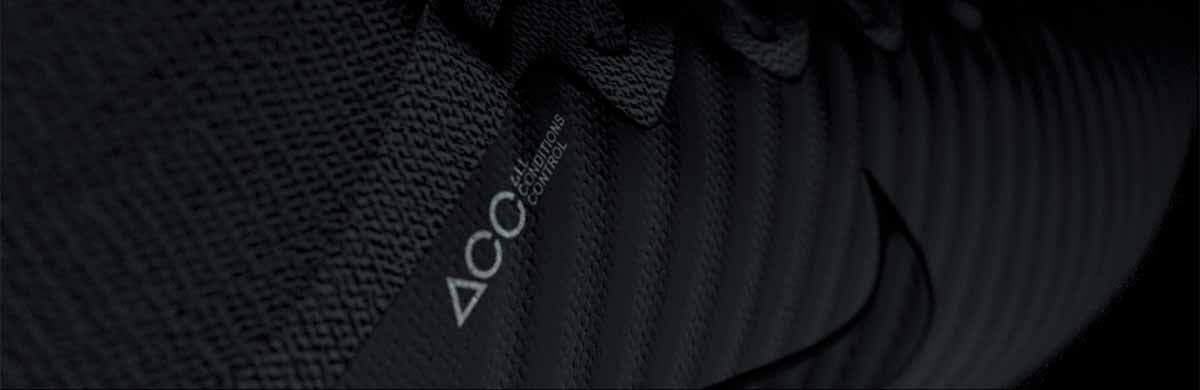 Close-up of dark ribbed textile fabric with a small Nike swoosh logo