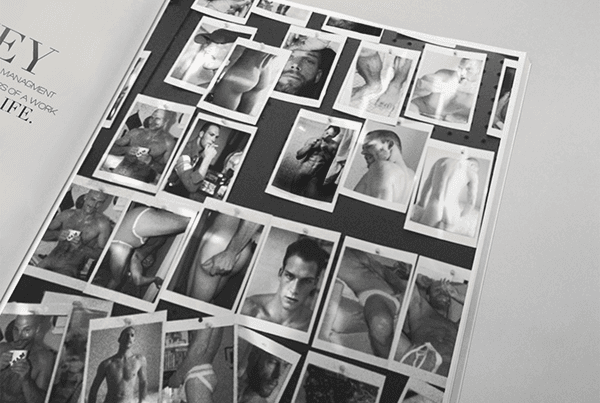 Book spread with a grid of small black-and-white polaroid-style photos of men pinned across the page.