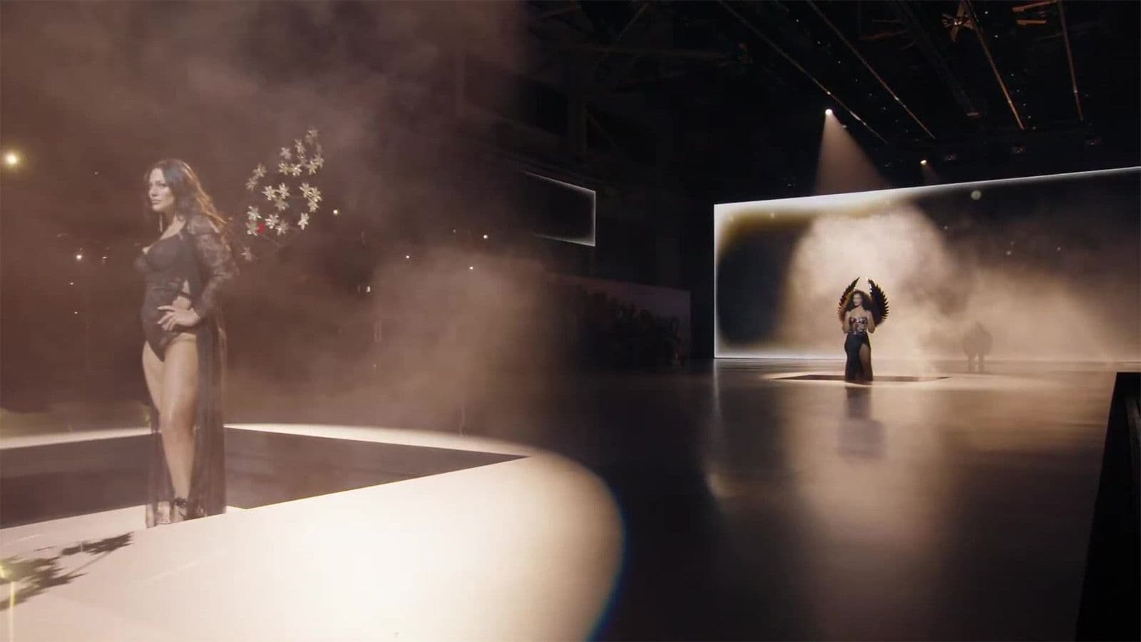 Split view of a model standing on a curved white stage on the left and a performer silhouetted against a lit screen on the right.