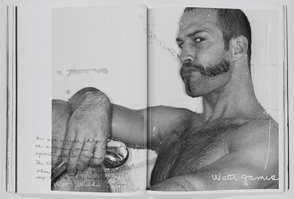 Open book spread from the Hunter photobook showing a shirtless bearded man on the right page and a handwritten note over a photo on the left.
