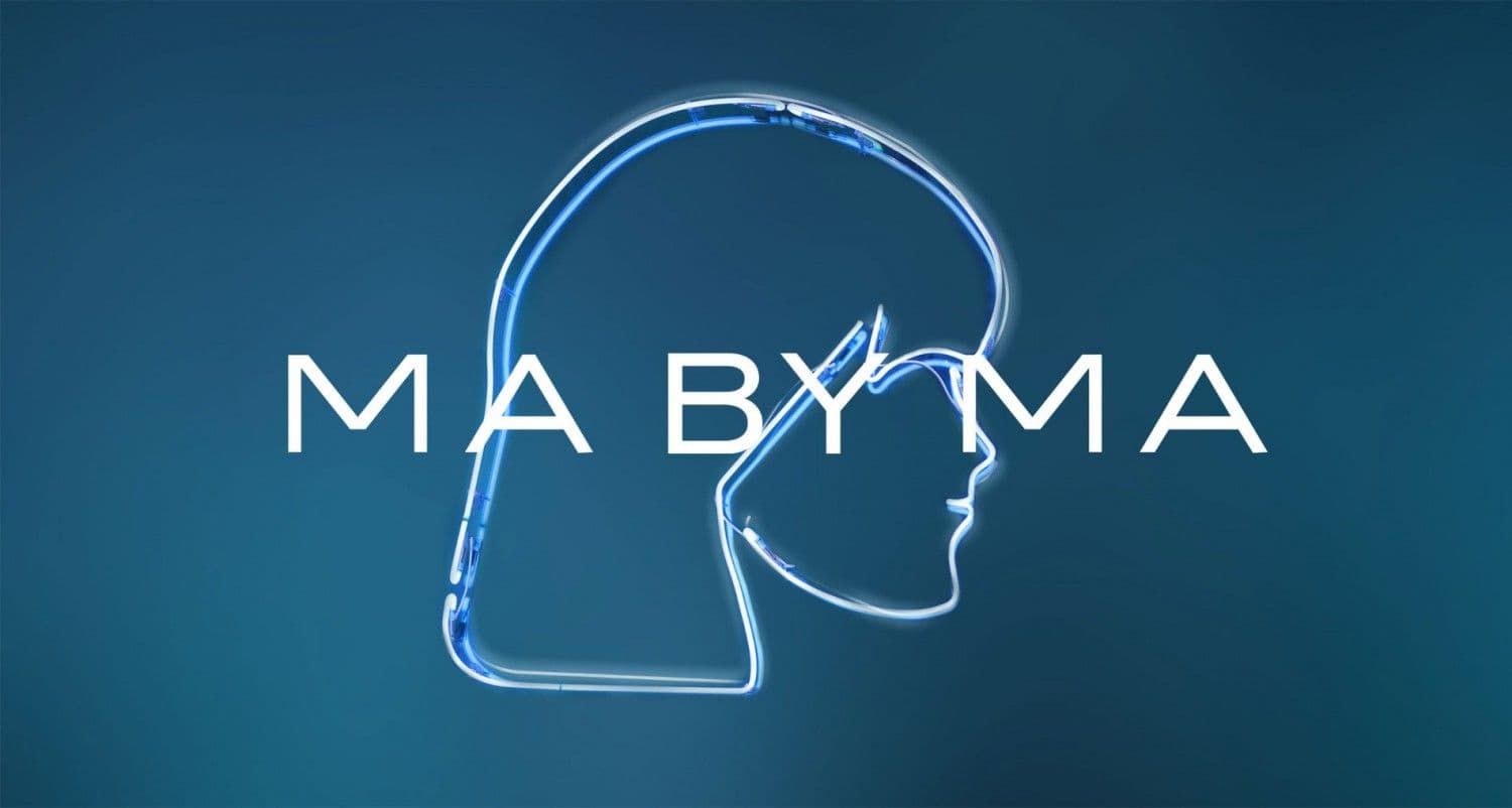 Illuminated blue neon-style outline of a woman's profile and hair beside the MA BY MA wordmark on a teal gradient background.